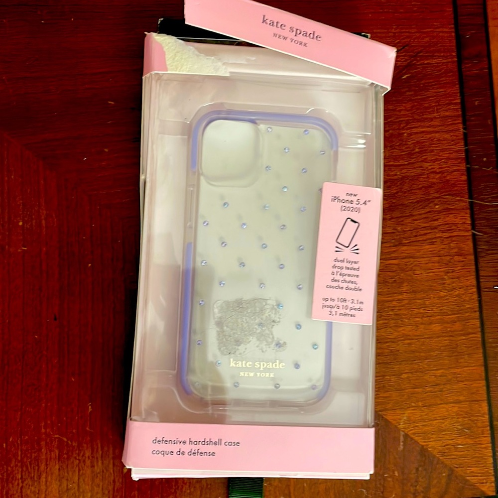 Kate Spade Defensive hard shell case. New but box opened. For iPhone 5.4 inch.